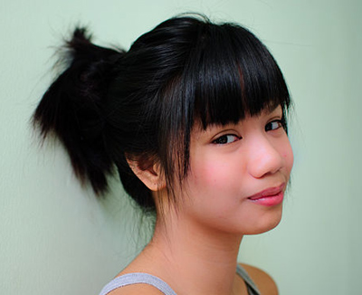Black Straight Asian Hair In Messy Bun Hairdo With Fringe Careforhair Co Uk Careforhair Co Uk It perfectly suits with the hair bangs and reddish color of the hair. discover new trendy hairdos haircuts careforhair co uk