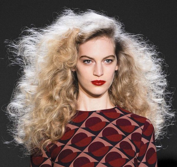 Long Curly Blonde Hair In Voluminous Back Combed Hairstyle